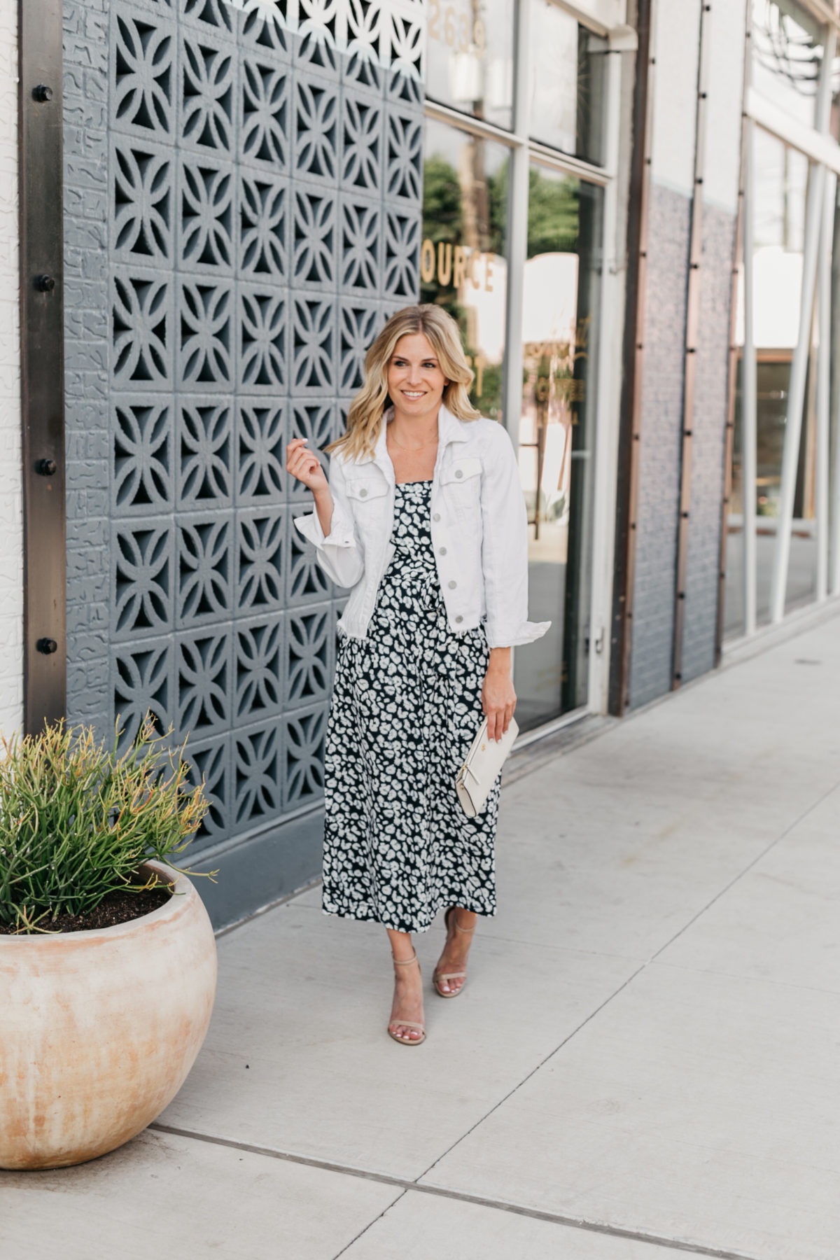 One Small Blonde is wearing a navy leopard jumpsuit from Banana Republic