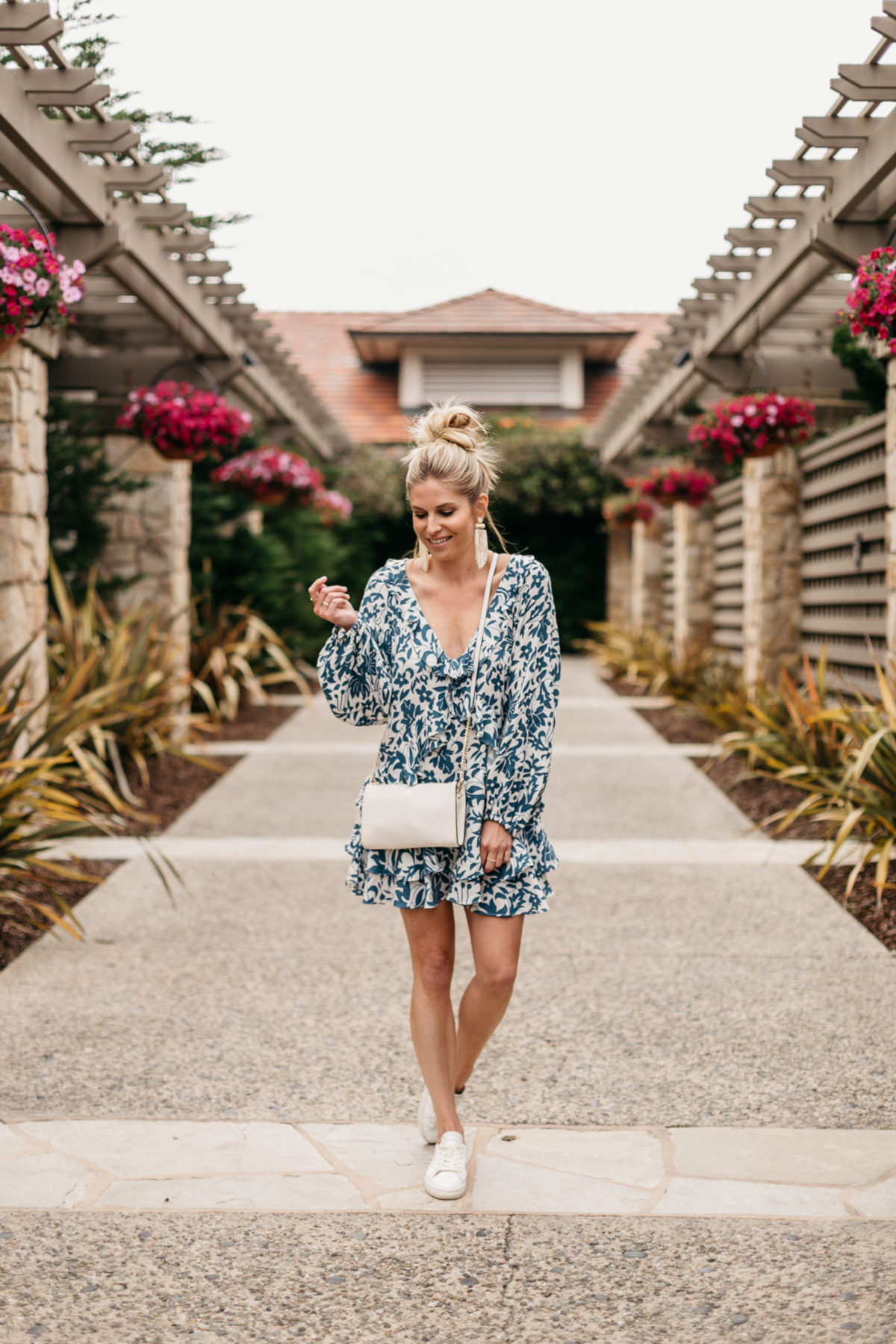 Brooke's outfit: Blue Long Sleeve Ruffle Minidress // White Earrings // White Crossbody // White Walking Tennis Shoes