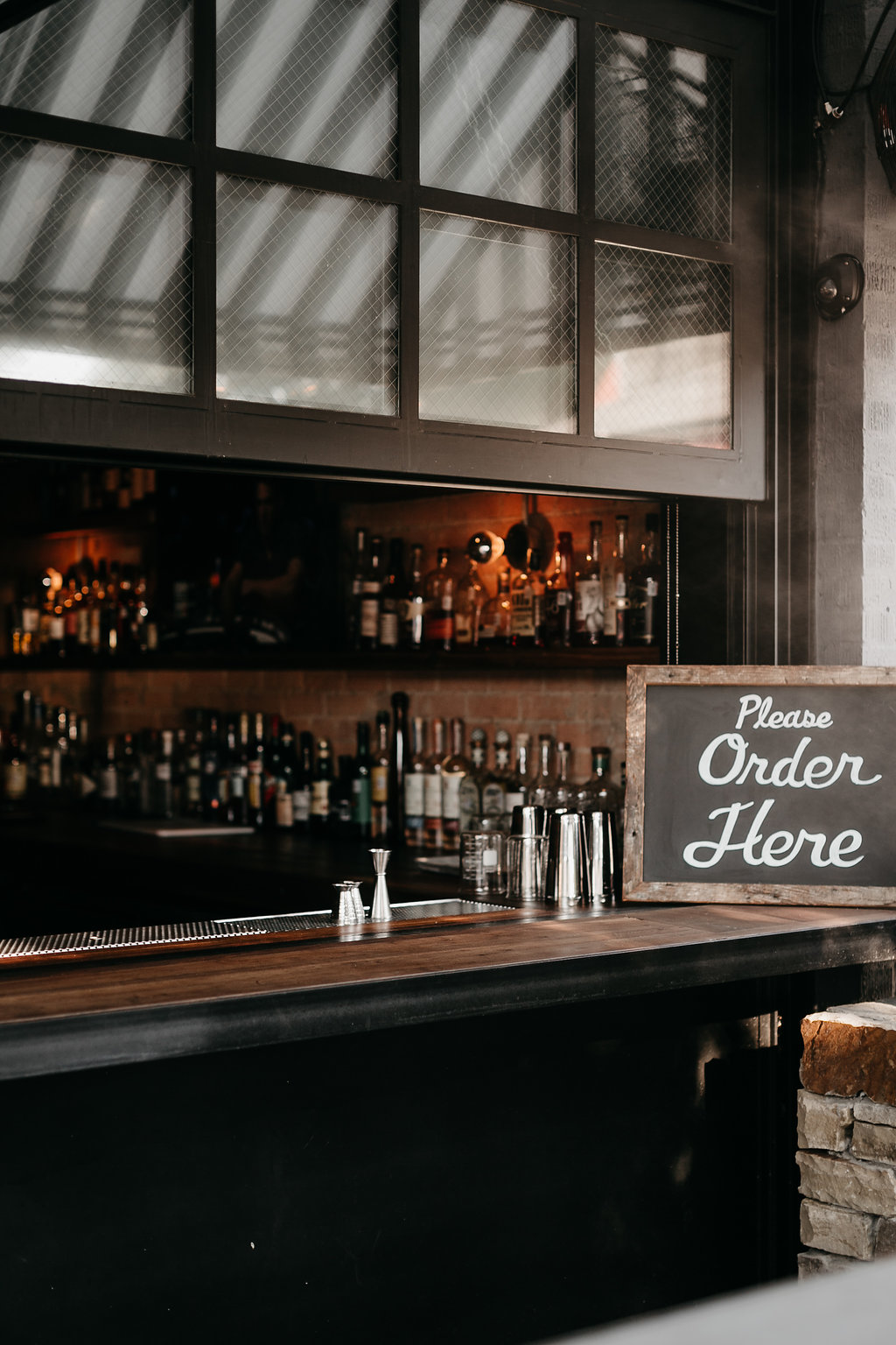 liquor and bar counter at LAUREL TAVERN